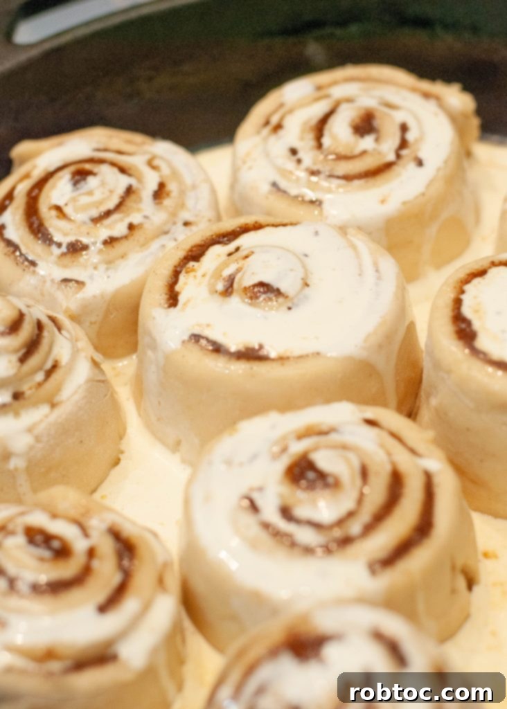 cinnamon-rolls-pre-rise-with-heavy-cream-poured-on-top