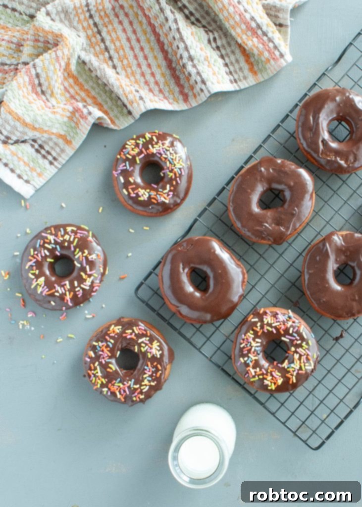 Looking down at frosted gluten-free donuts with sprinkles