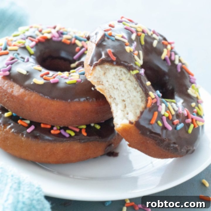 Gluten-free donut with a bite taken out, showing the fluffy interior