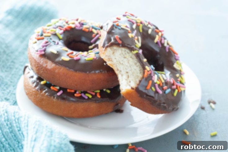 Stacked gluten-free donuts with a bite taken out, perfect for Pinterest