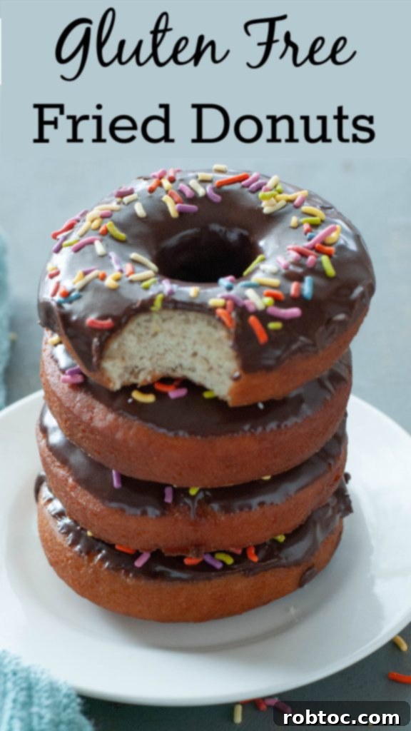 Stacked gluten-free donuts with a bite taken out, a perfect Pinterest image