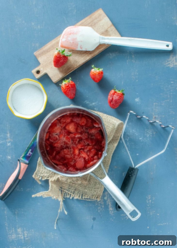low-sugar-strawberry-compote-in-a-sauce-pan-overhead