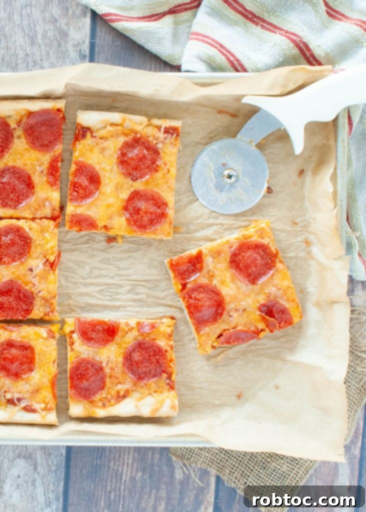 Gluten-free pizza cut into squares, showcasing a fully baked and topped pizza ready to be served