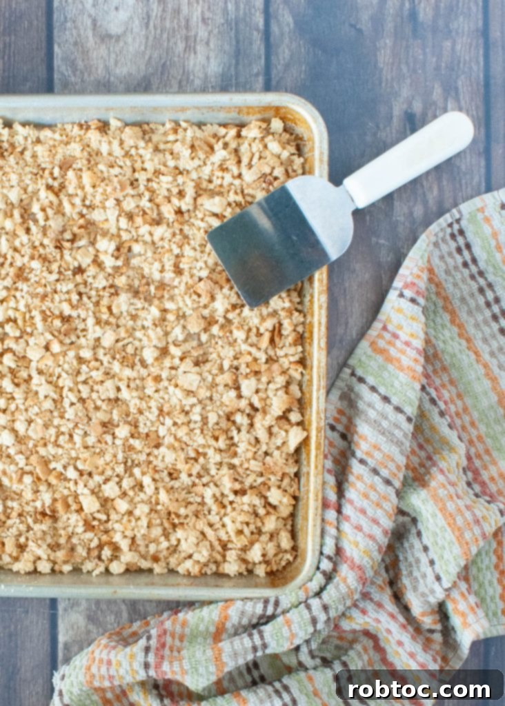Simple Homemade Gluten-Free Breadcrumbs 3 A close-up shot of a sheet pan filled with perfectly golden, homemade gluten-free breadcrumbs.
