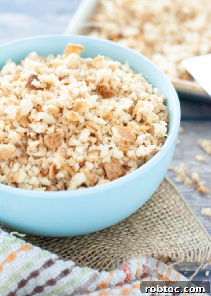 Simple Homemade Gluten-Free Breadcrumbs 4 A vibrant blue bowl filled with golden, homemade gluten-free breadcrumbs, ready for use.