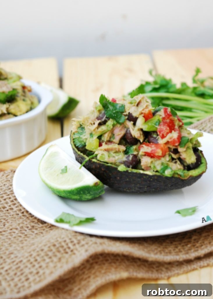 Close-up of freshly prepared Mexican Tuna Salad, showcasing its vibrant ingredients like avocado, red pepper, and cilantro.