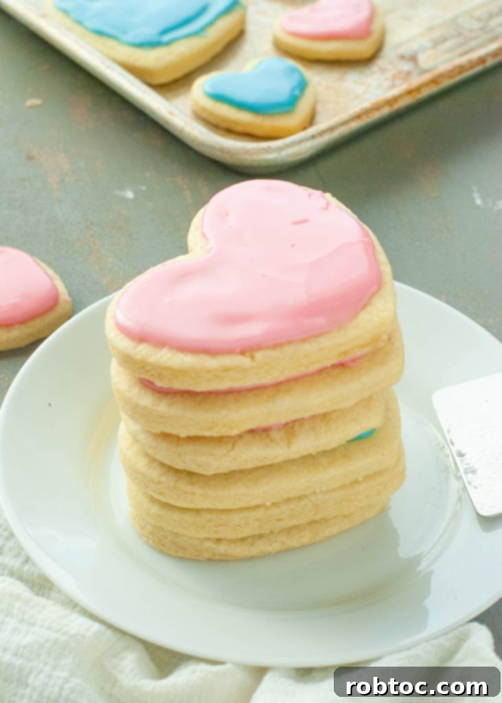 pink-heart-shaped-gluten-free-sugar-cookies-stacked-on-top-of-each-other