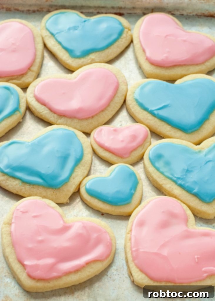 pink-and-blue-gluten-free-sugar-cookies-on-a-baking-sheet