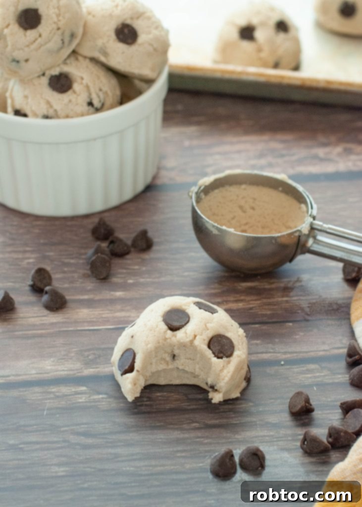 Easy Gluten Free Egg Free Edible Cookie Dough Recipe 6 a-ball-of-raw-chocolate-chip-cookie-dough-with-a-bite-taken-out