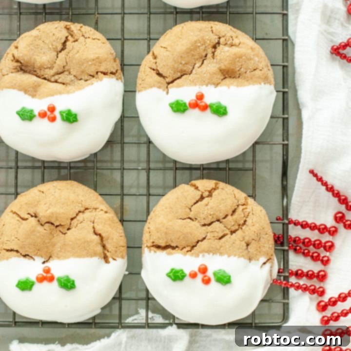 gluten-free-gingerbread-cookies-with-holly-berry-sprinkles-on-a-cooling-rack
