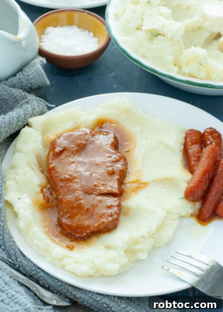 Creamy Dairy-Free Mashed Potatoes Secret Ingredient Video 3 dairy-free mashed potatoes with pork chops on top