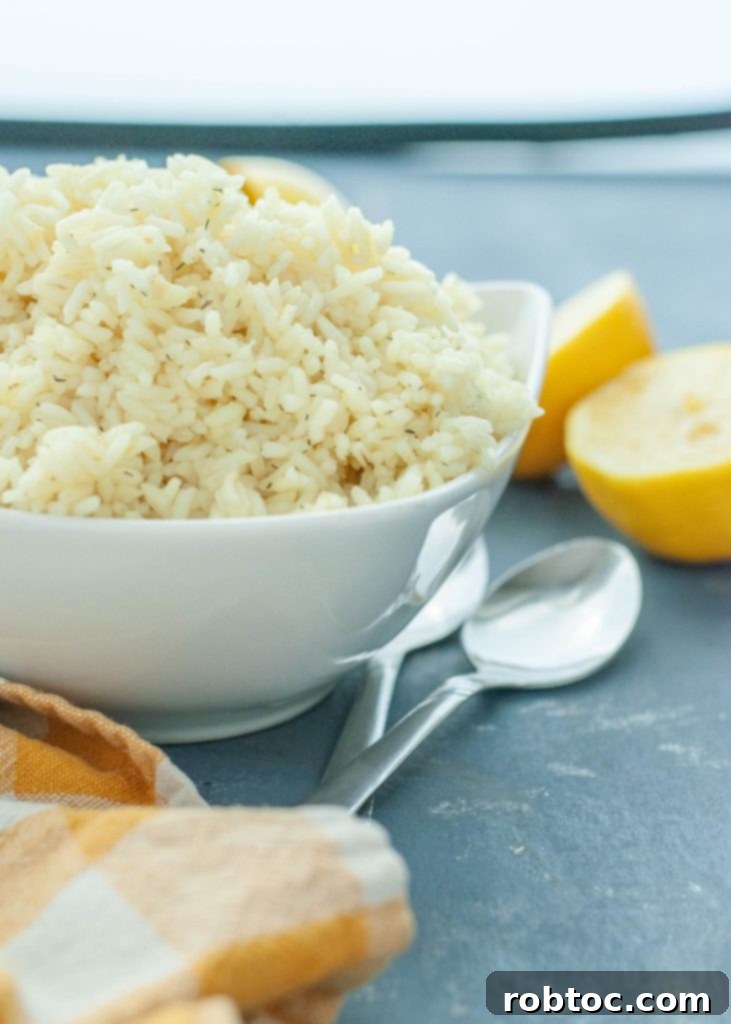 Vibrant Instant Pot Mediterranean Lemon Rice 4 lemon-rice-in-a-white-bowl-with-lemons-on-the-side-ready-to-serve