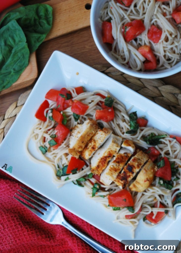 Bruschetta Chicken Pasta Garnished with Fresh Basil